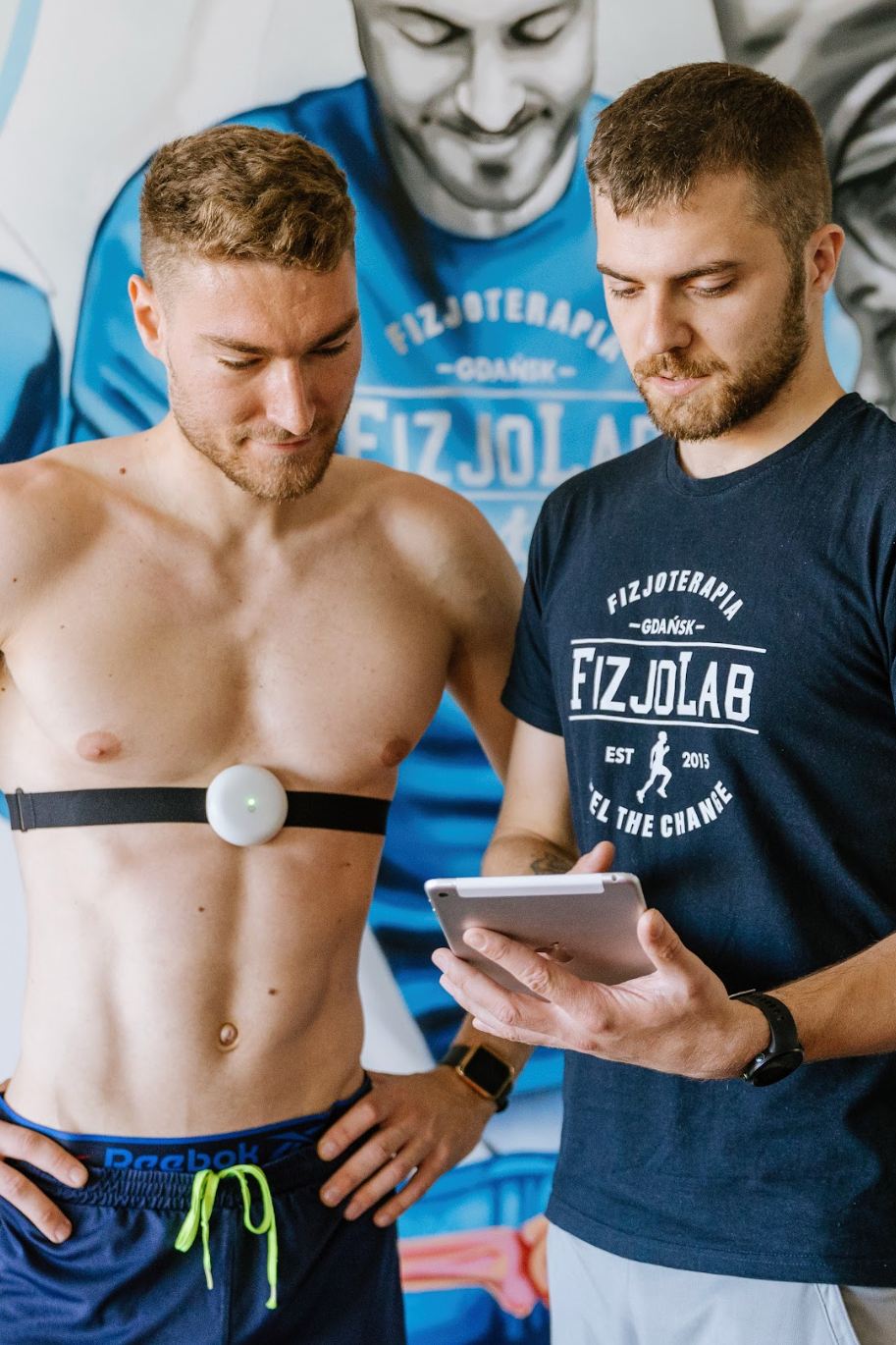 Male wearing Aidmed, assisted by physiotherapist